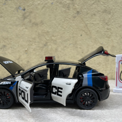 ​Mô hình xe Police Mỹ Tesla Model CX90  tỷ lệ 1:24