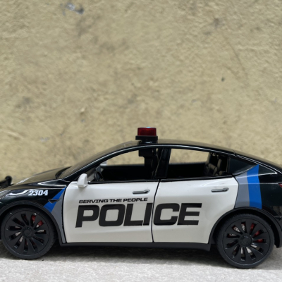 ​Mô hình xe Police Mỹ Tesla Model CX90  tỷ lệ 1:24