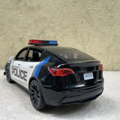 ​Mô hình xe Police Mỹ Tesla Model CX90  tỷ lệ 1:24
